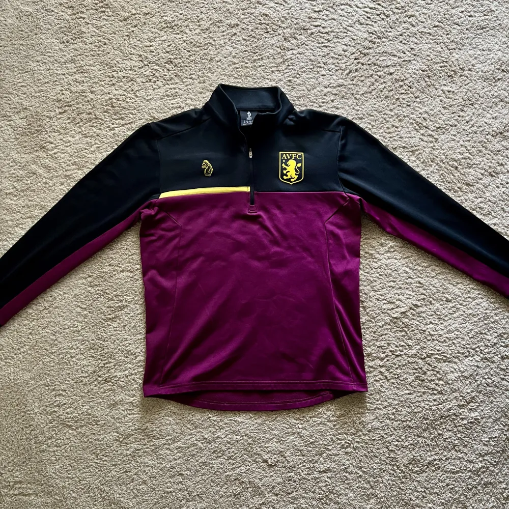 Front view of Aston Villa 2018/19 Luke 1977 1 Track Shirt - Men's Medium