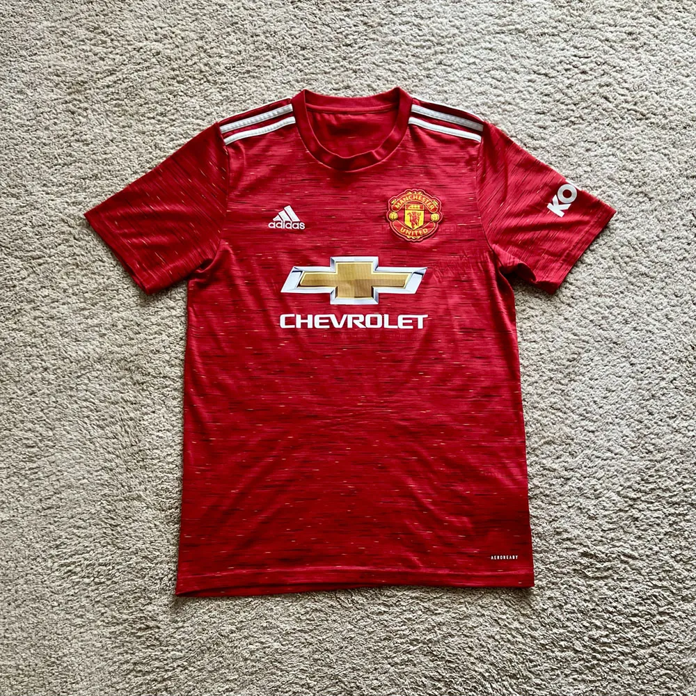 Front view of Manchester United 2020/21 Adidas Home Shirt (Chevrolet) - Men's Medium