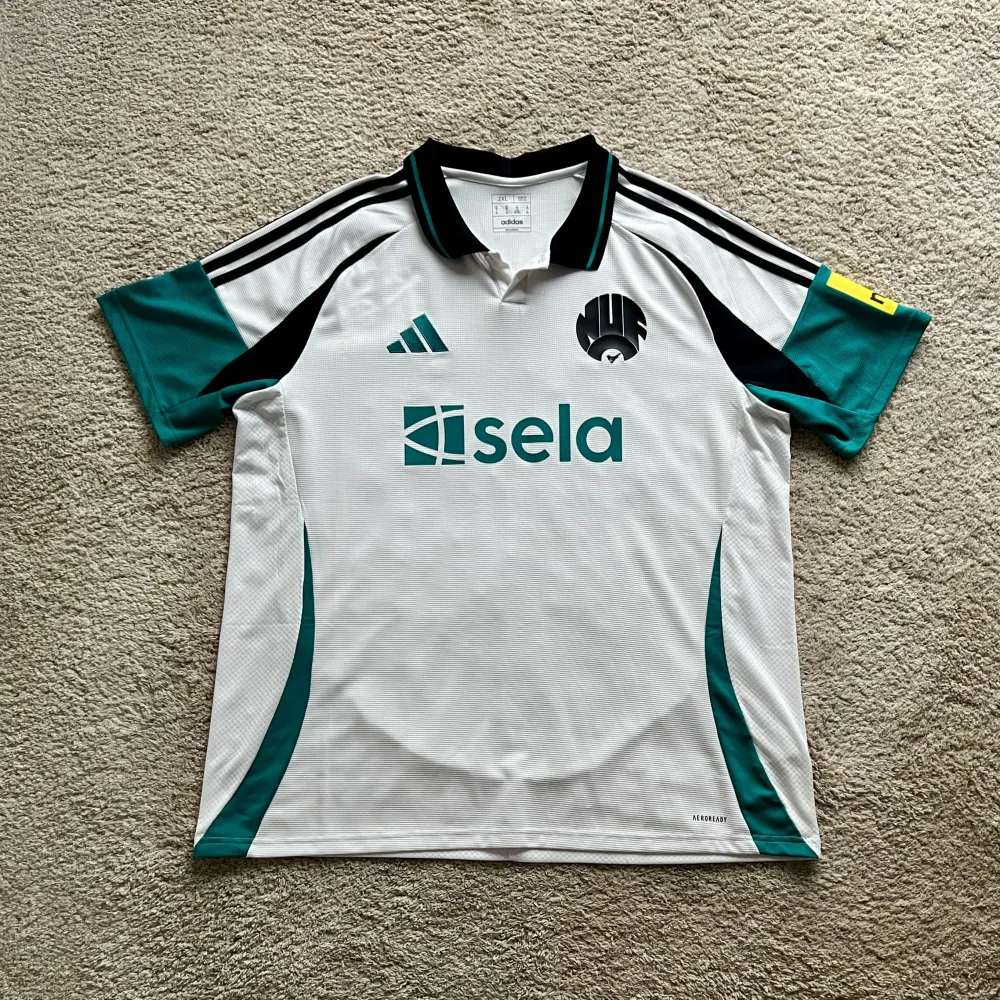 Front view of Newcastle United 2023/24 Adidas 3rd Shirt (Sela) - Men's XXL