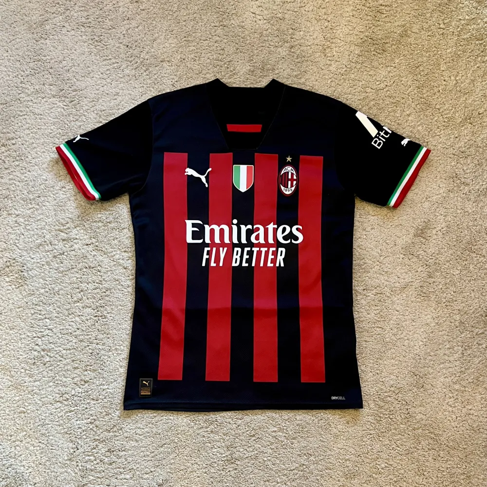 Front view of AC Milan 2022/23 Puma Home Shirt (Fly Emirates) - Men's Small