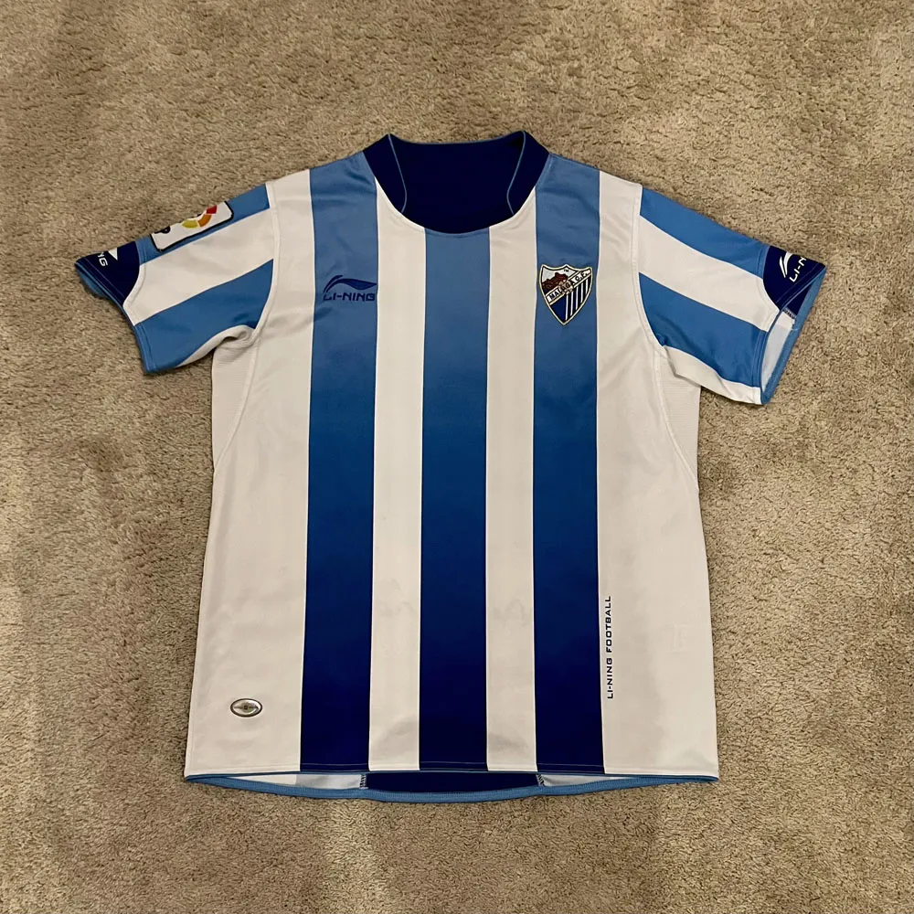 Front view of Malaga CF 2010/11 Li-Ning Home Shirt - Men's Large