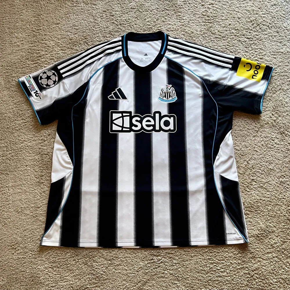 Front view of Newcastle United 2025/26 Adidas Home Shirt (Sela) - Men's 3XL