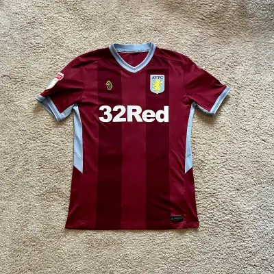 Front view of Aston Villa 2018/19 Luke 1977 Home Shirt (32Red) - Men's Medium